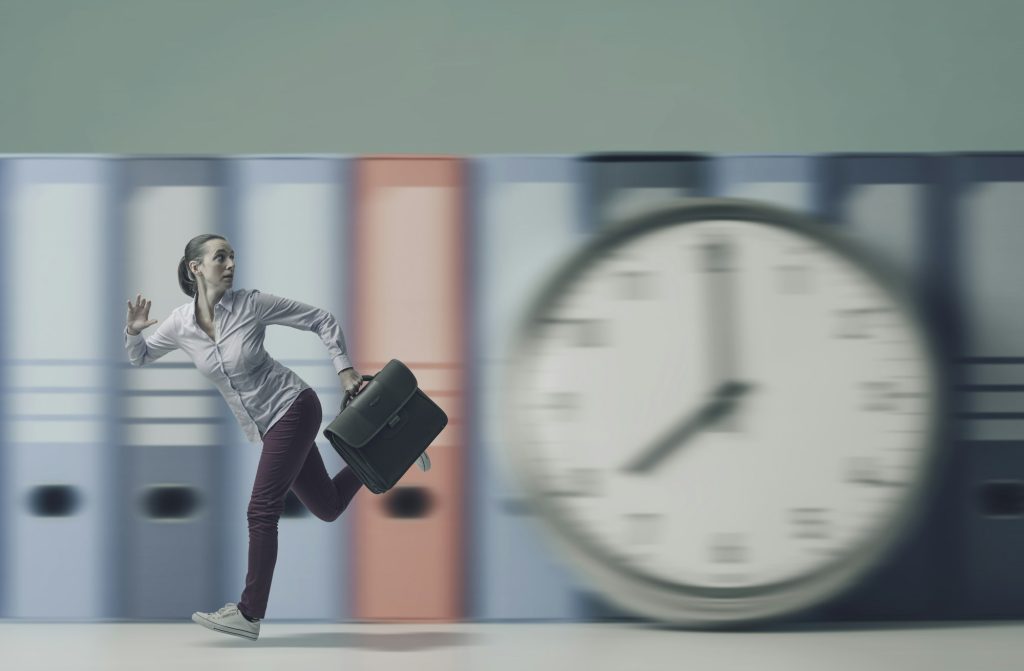 Stressed businesswoman running fast, she is late for work